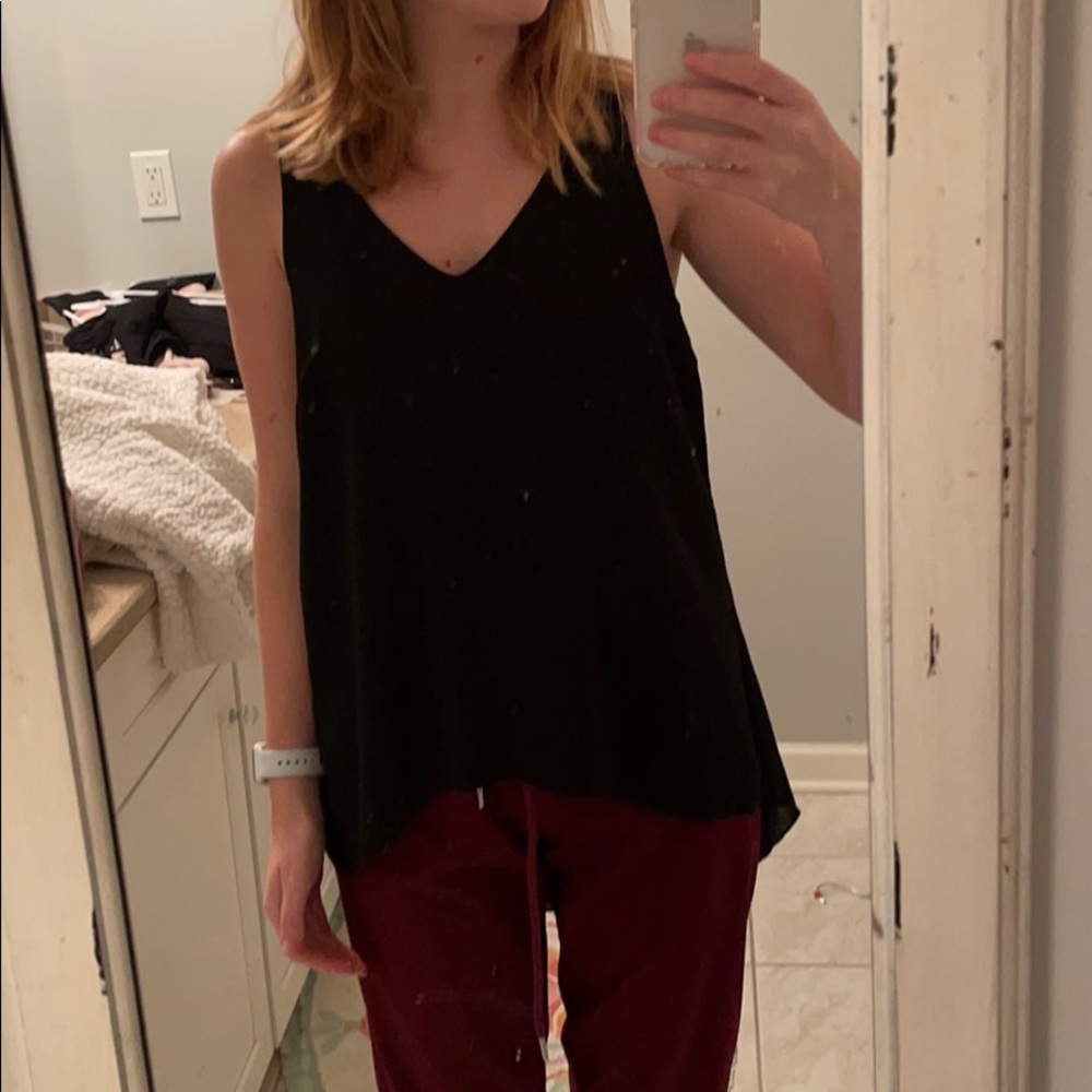Black tank, longer in the back